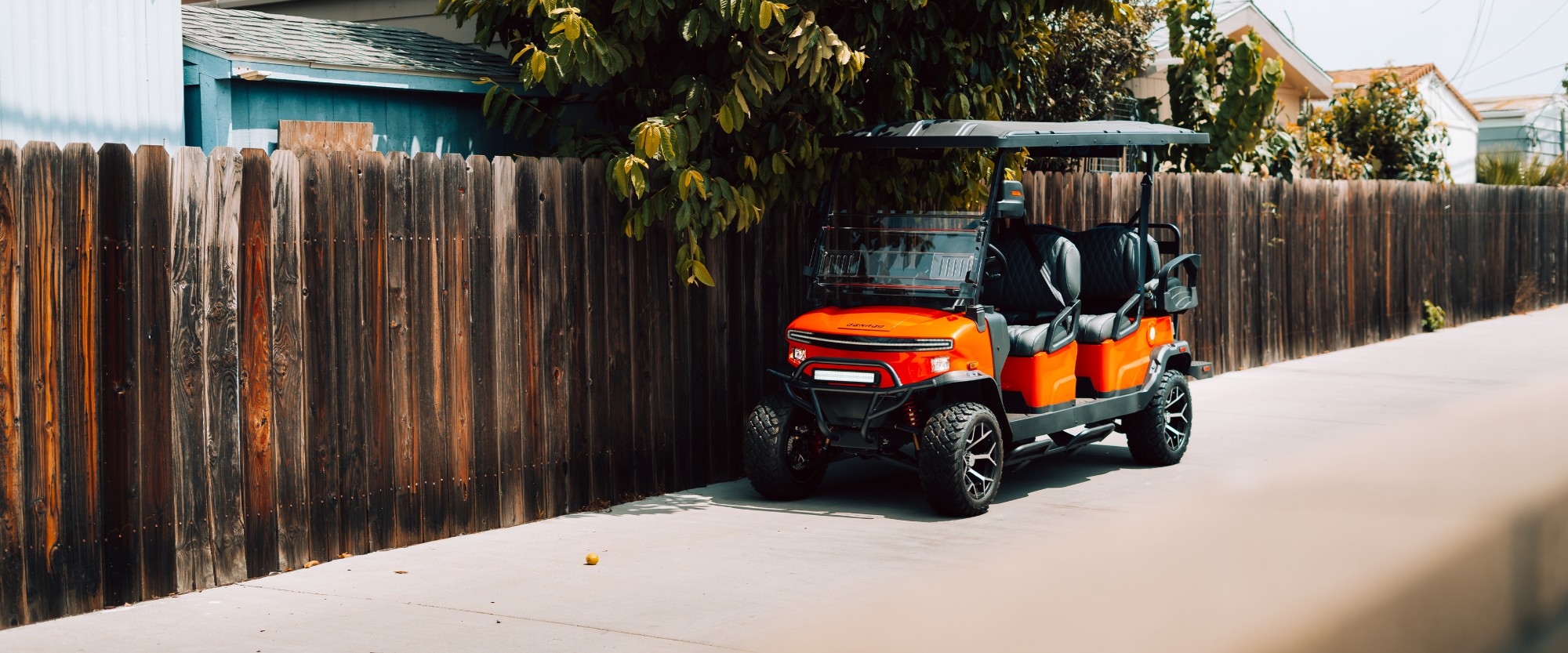 Lifted golf cart on a Southern California street
